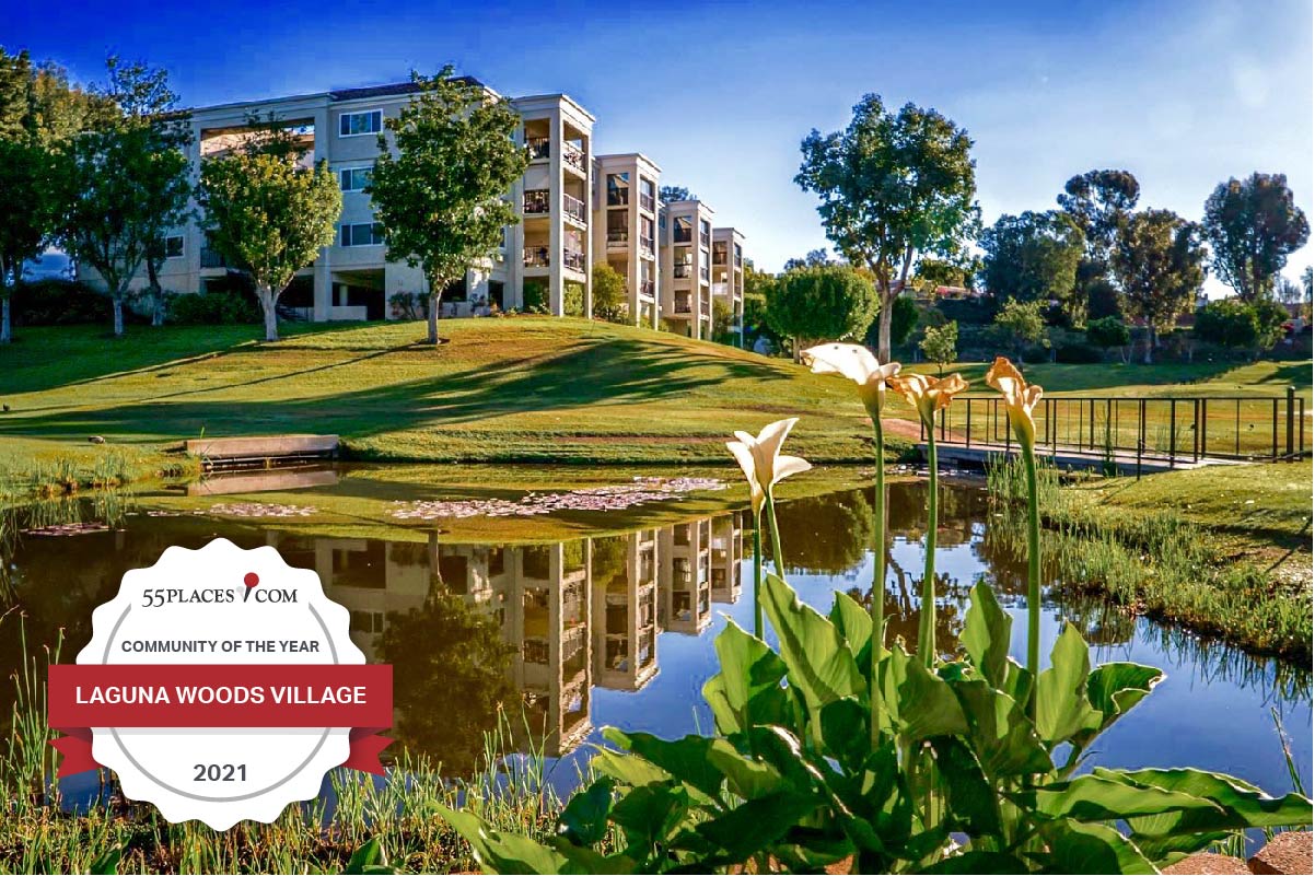 "Community of the Year" badge over a pond beside condo buildings at Laguna Woods Village in California