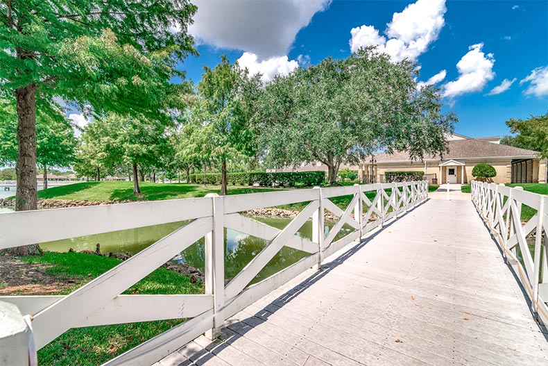 A bridge over a picturesque pond at CountryPlace in Pearland, Texas