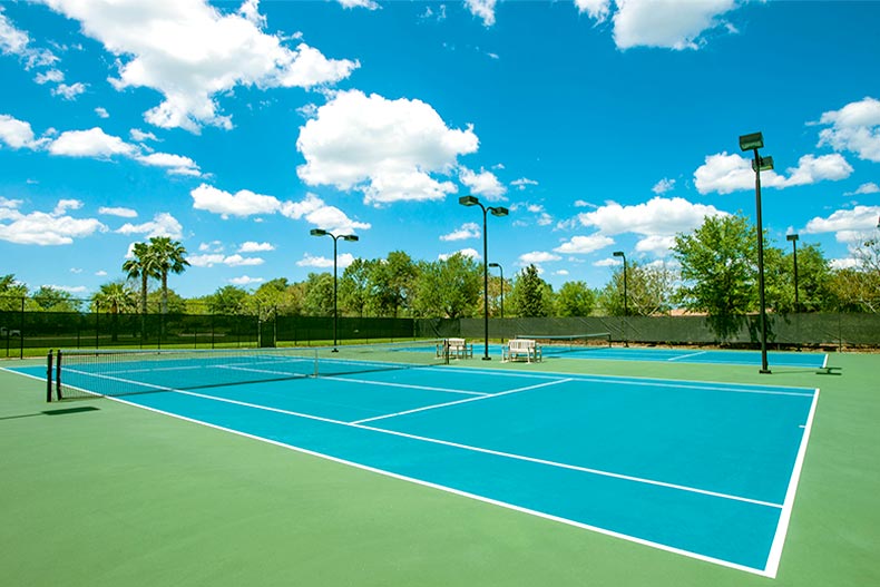 View of two tennis courts at Cypress Falls at the Woodlands in North Port, Florida