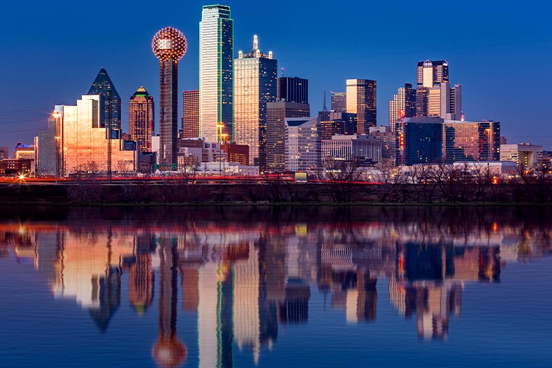 Dallas, Texas skyline reflecting in the Trinity River at sunset