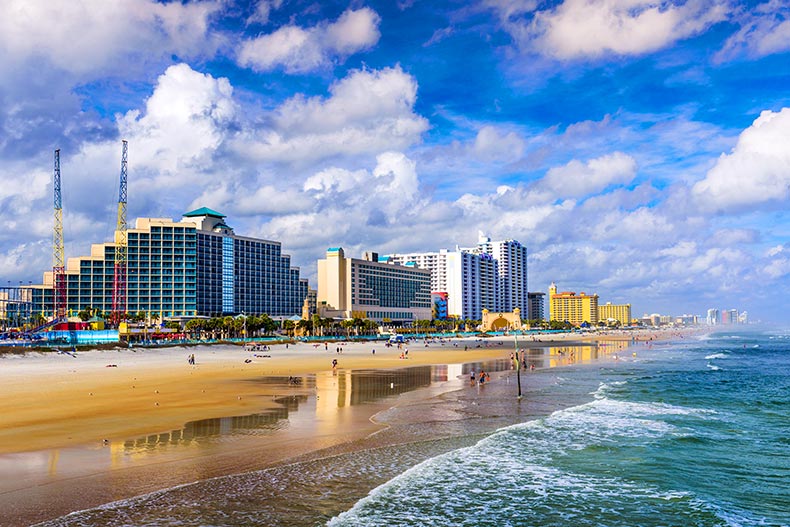 Wide shot of the Daytona Beach, Florida boardwalk, beach, and skyline