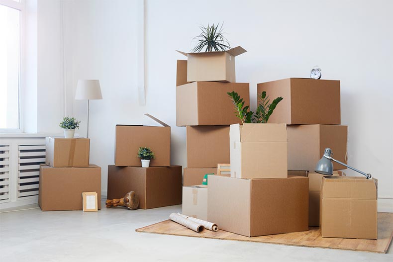 A pile of boxes cleaned out of a cluttered room