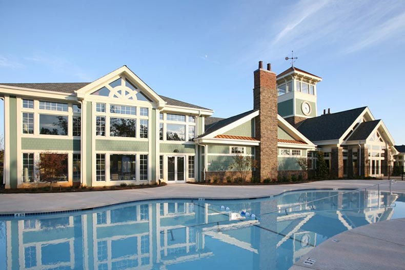 Exterior view of the clubhouse and outdoor pool at Del Webb at Lake Oconee in Greensboro, Georgia