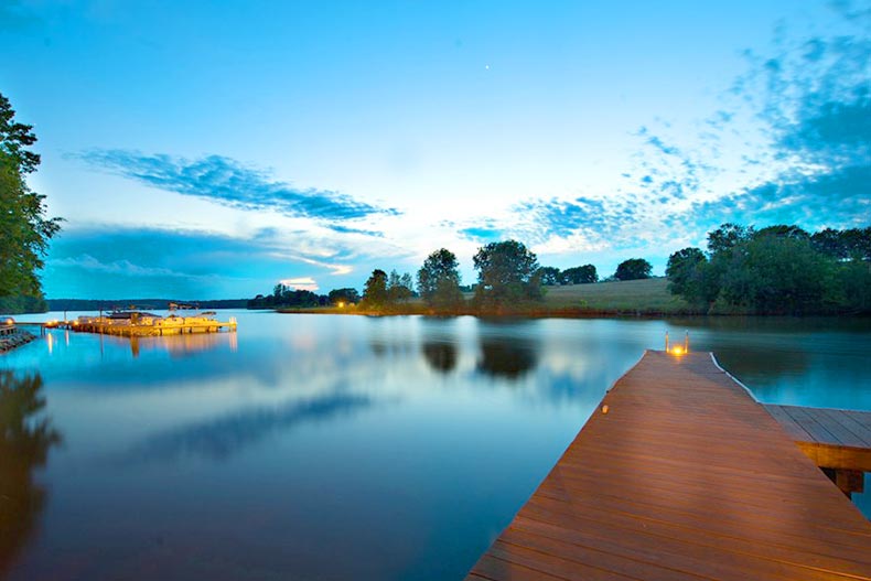 A dock extending into the lake at Del Webb at Lake Oconee in Greensboro, Georgia at night