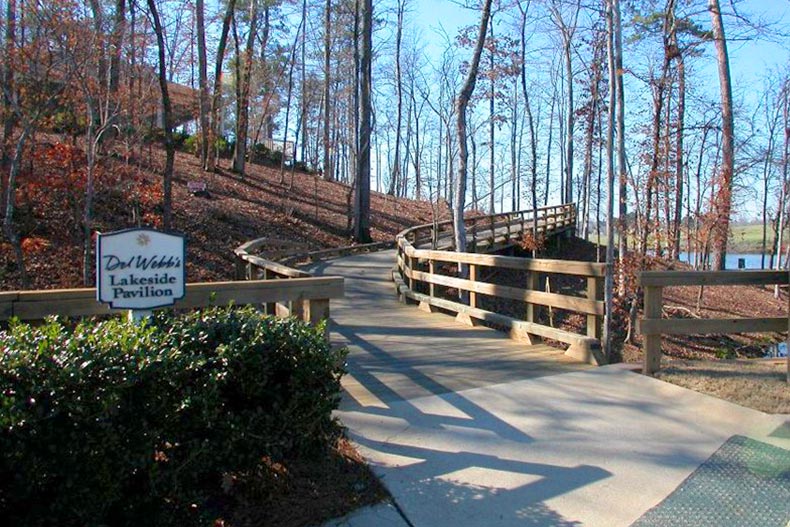 Trees surrounding the paved trail to the Lakeside Pavilion at Del Webb at Lake Oconee in Greensboro, Georgia