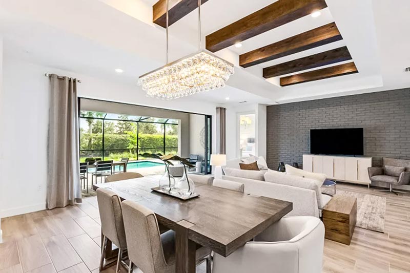 Open-concept interior layout with a pool and patio.