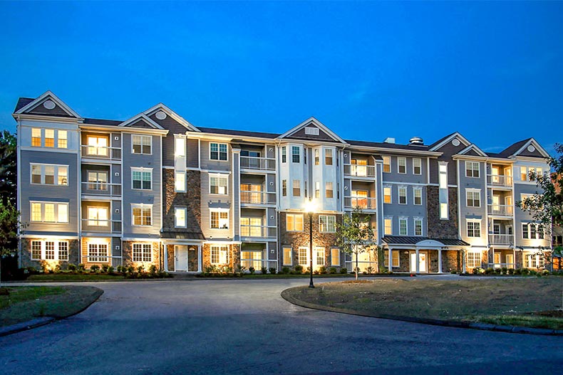 Exterior view of a condo building at Del Webb Chauncy Lake in Westborough, Massachusetts