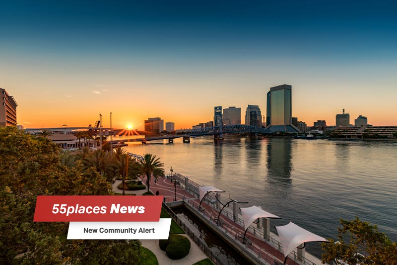 Jacksonville, FL river walk at sunset with 55places News banner overlay and new community alert text.