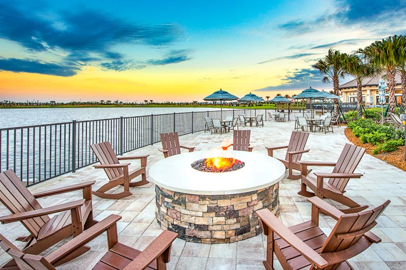 Lounge chairs surrounding an outdoor firepit at Del Webb Lakewood Ranch in Florida