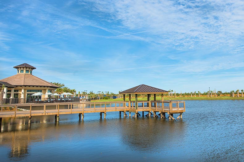 A dock extending over a pond at Del Webb Lakewood Ranch in Lakewood Ranch, Florida