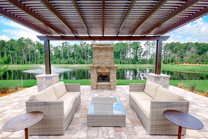 An outdoor patio and fireplace at Twin Lakes in St. Cloud, Florida