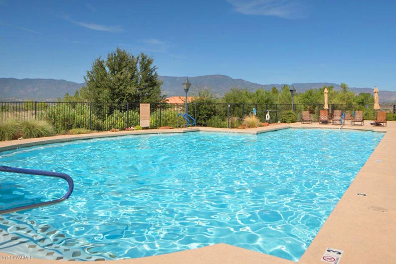 Mountains and greenery surrounding the outdoor pool at Dorado at Verde Santa Fe in Cornville, Arizona