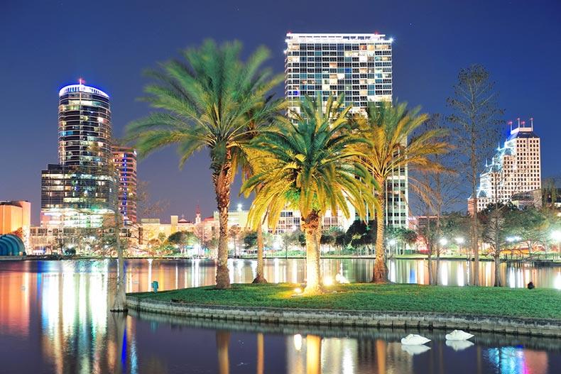 View of the downtown skyline over Lake Eola at night in Orlando, Florida