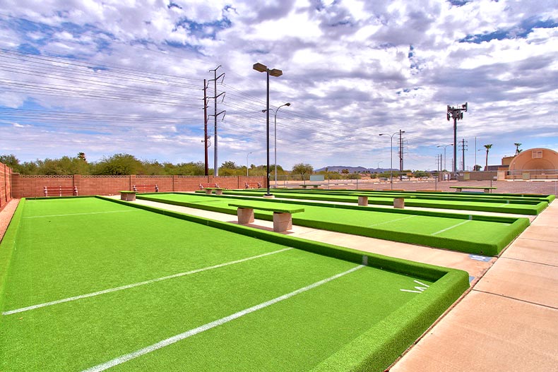 Photo of the four bocce ball courts in Dreamland Villa with the amphitheater in the background