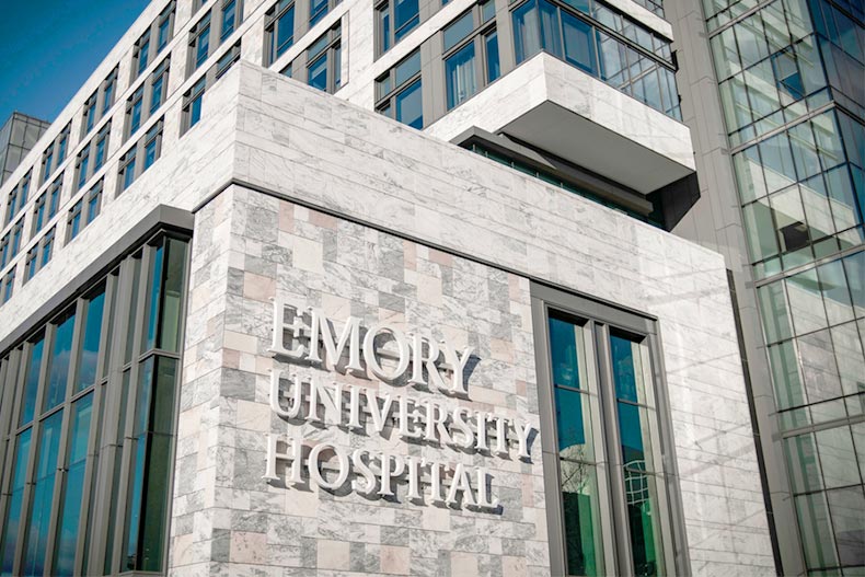 The Emory University Hospital sign and building in Atlanta, Georgia