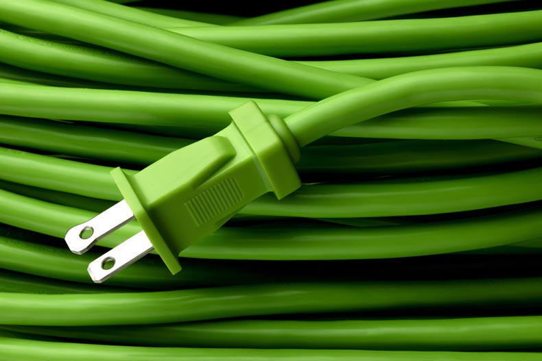 Close up of a bright green electric extension cord