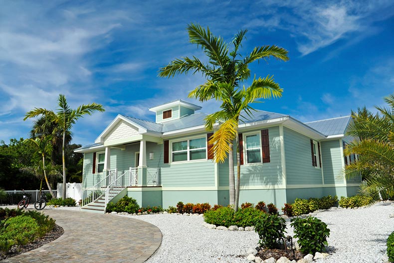 Exterior view of a new beach house with manicured landscaping