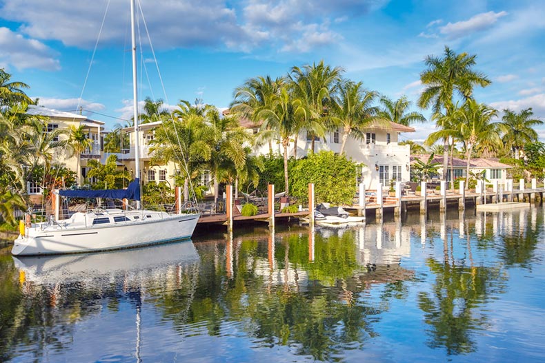 A yacht docked in front of waterfront homes in Fort Lauderdale, Florida