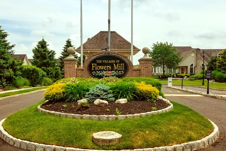 A welcome sign near the entrance gate in The Villages of Flowers Mill, located in Coatesville, Pennsylvania