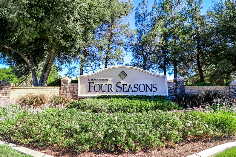 Greenery surrounding the community sign for Four Seasons at Hemet in Hemet, California