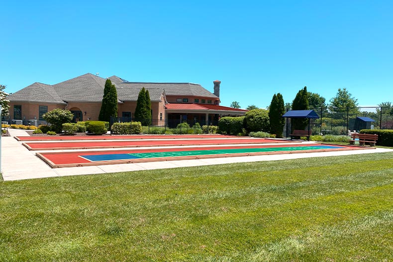 Shuffleboard courts and the clubhouse at the Foxfield 55+ community in Garnet Valley, Pennsylvania