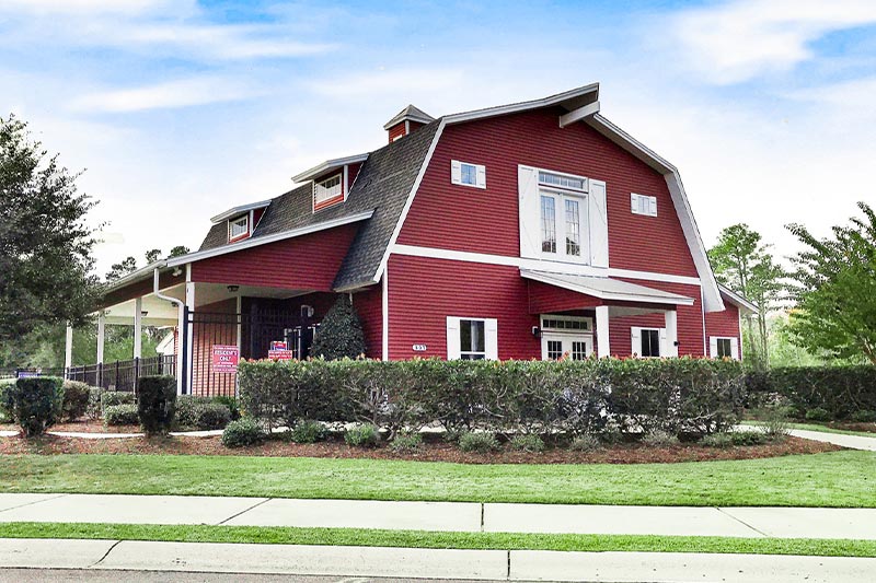 Red barn-style home at The Farm at Brunswick in Carolina Shores, NC.