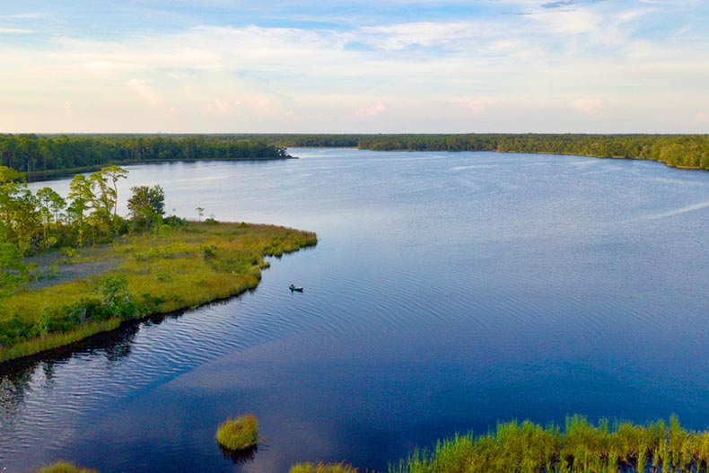 Aerial view of a lone fisherman at Basin Bayou in Freeport, Florida