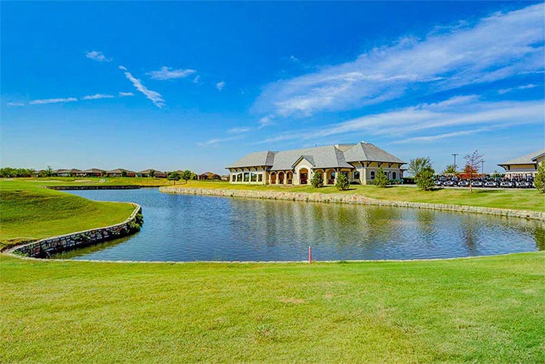 The clubhouse across a pond at Frisco Lakes in Frisco, Texas