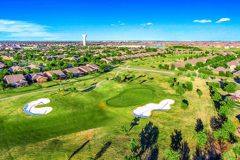 Aerial view of the houses surrounding the golf course at Frisco Lakes in Frisco, Texas