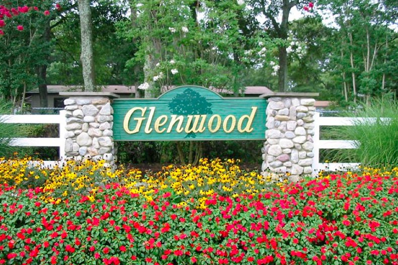 Flowers in front of the community sign for Glenwood Village in Riverhead, New York