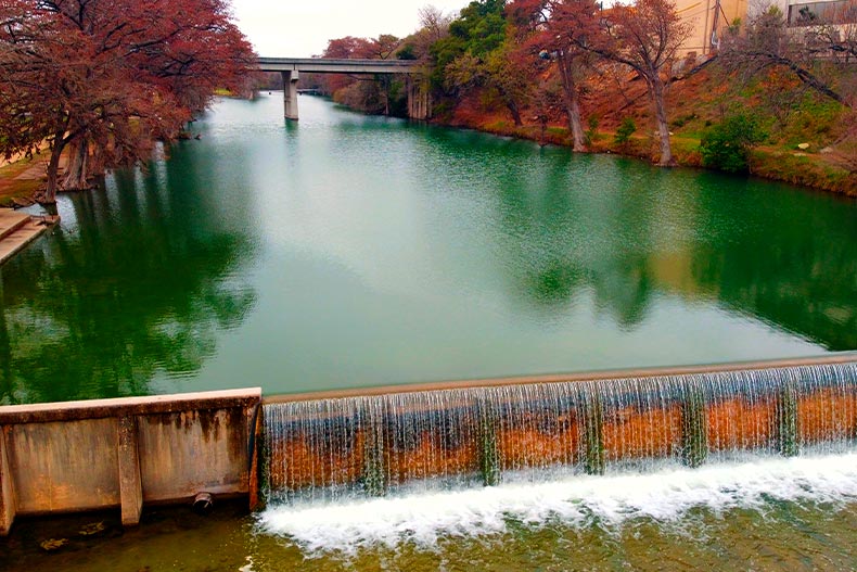 Water from the Guadalupe River flowing over a dam in Kerrville, Texas