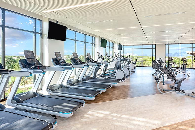 Treadmills and stationary bikes in a fitness center at Kissing Tree in San Marcos, Texas