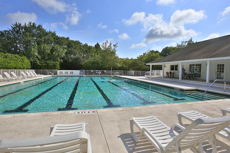 Lounge chairs surrounding the outdoor pool at Halifax Plantation in Ormond Beach, Florida