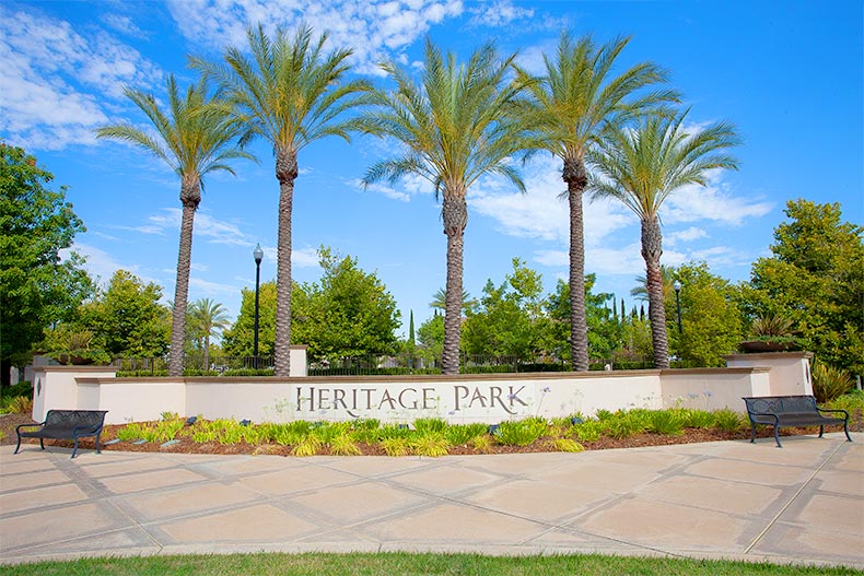 Palm trees behind the sign for Heritage Park in Sacramento, California