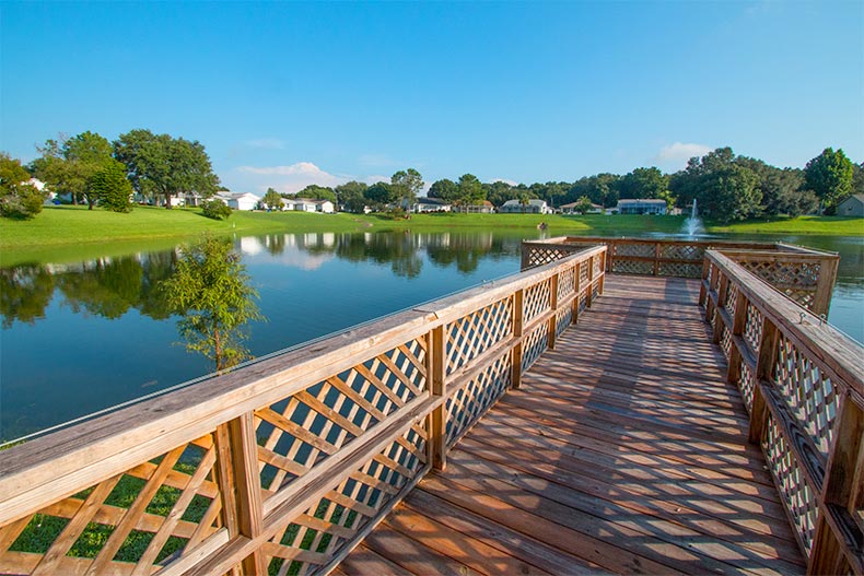 A dock on a picturesque pond at Highland Fairways in Lakeland, Florida