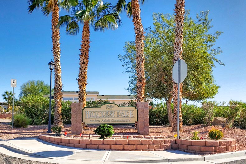 Palm trees behind the community sign for Hillcrest Park in Bullhead City, Arizona