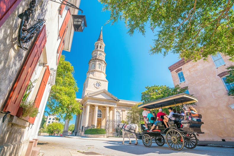 Tourists on a carriage ride in historical Downtown Charleston, South Carolina