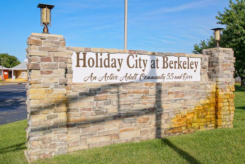A brick wall displaying the community sign for Holiday City at Berkeley in Toms River, New Jersey