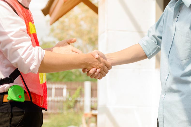 A homeowner shaking hands with a home inspector