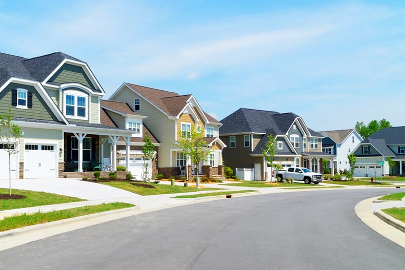 View down a suburban street lined with modern attached homes