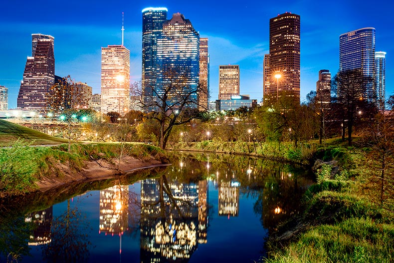View of Houston, Texas skyline from a pond just outside of the city