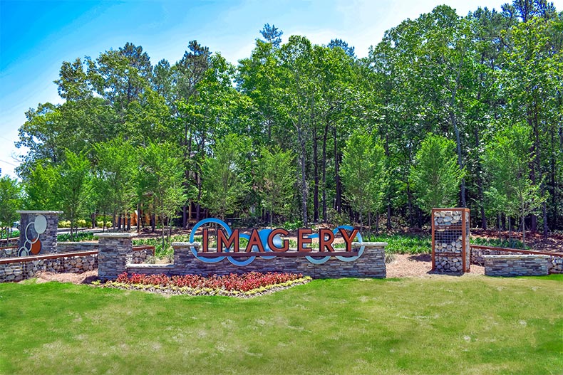 Greenery surrounding the community sign for Imagery in Mount Holly, North Carolina