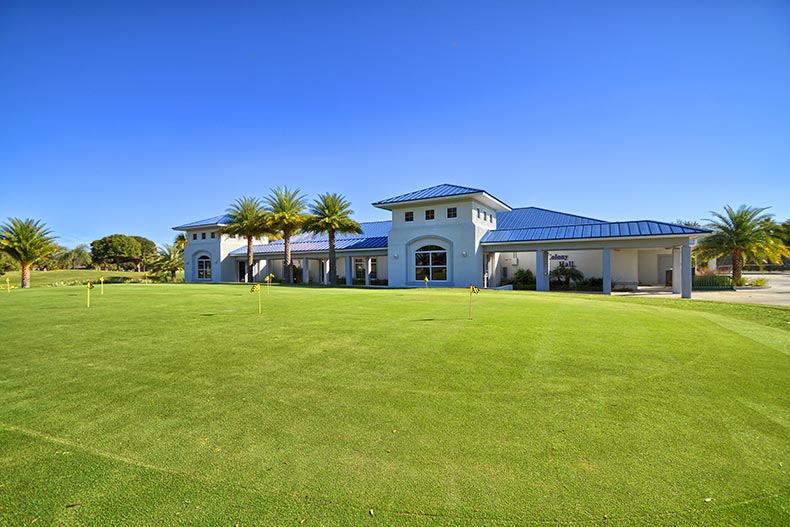A community building beside a golf green at Indian River Colony Club in Melbourne, Florida
