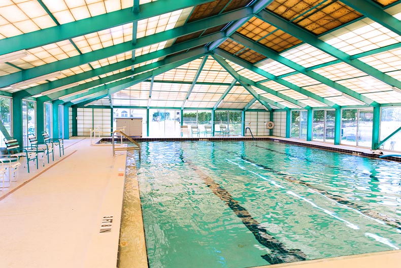 View of an indoor pool with lap lanes located in the Oak Run community of Ocala, Florida