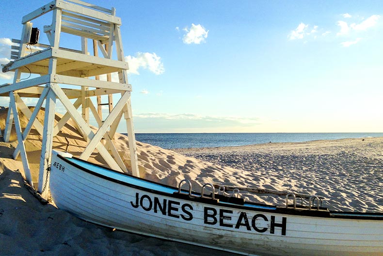 A wooden boat and lifeguard chair on Jones Beach State Park on Long Island, New York