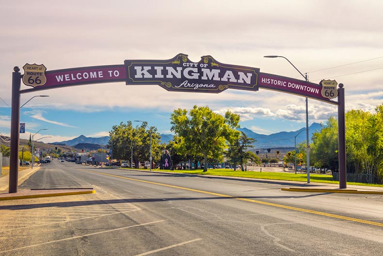 A wide arched street sign marking the city of Kingman, Arizona on historic route 66