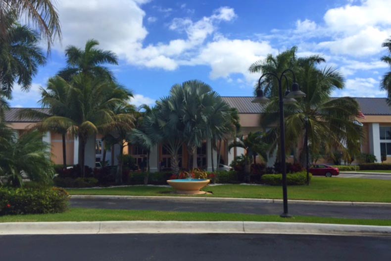 Palm trees surrounding a community building at Kings Point in Tamarac in Florida