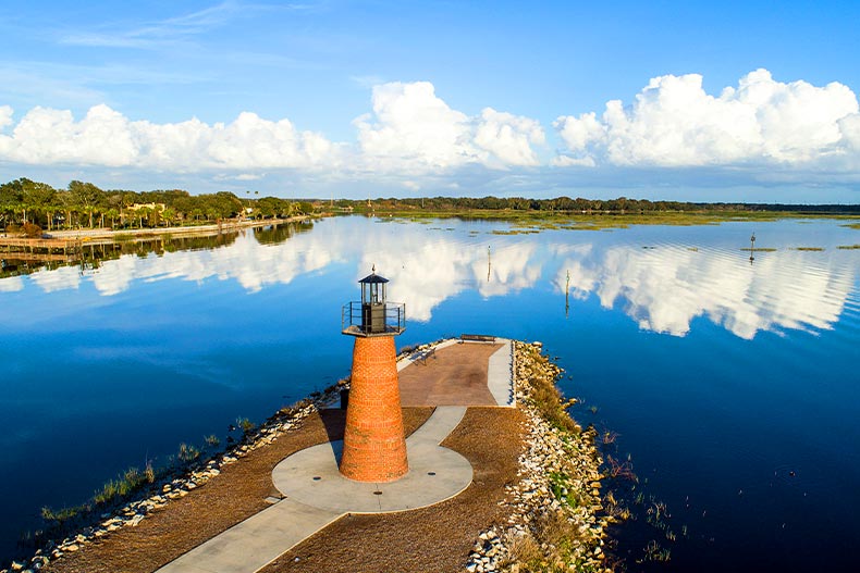 View of a lighthouse by a lake in Lakefront Park of Kissimmee, Florida