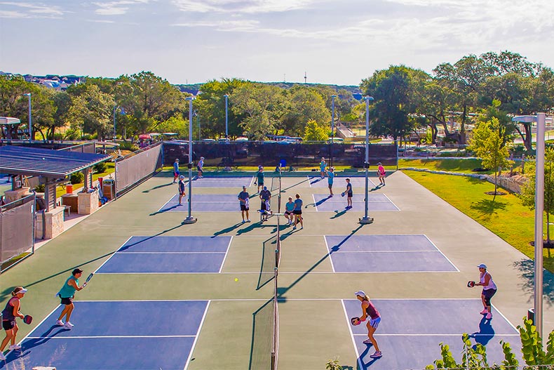 Residents playing pickelball at Kissing Tree in San Marcos, Texas