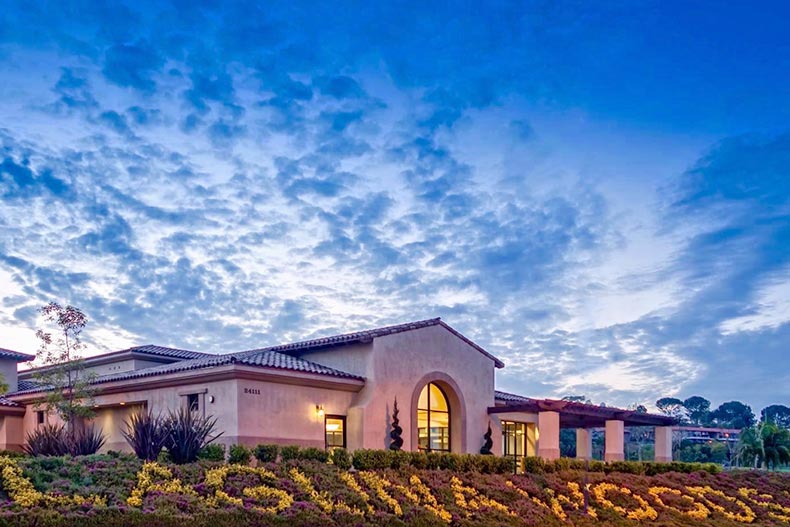 Exterior view of the clubhouse at night at Laguna Woods Village in Laguna Woods, California